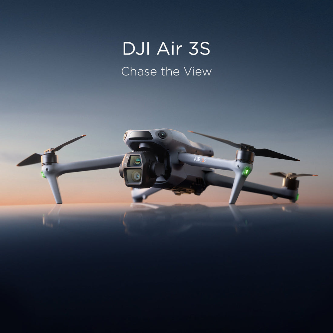 The DJI Air 3S resting upon a reflective surface during sunrise.