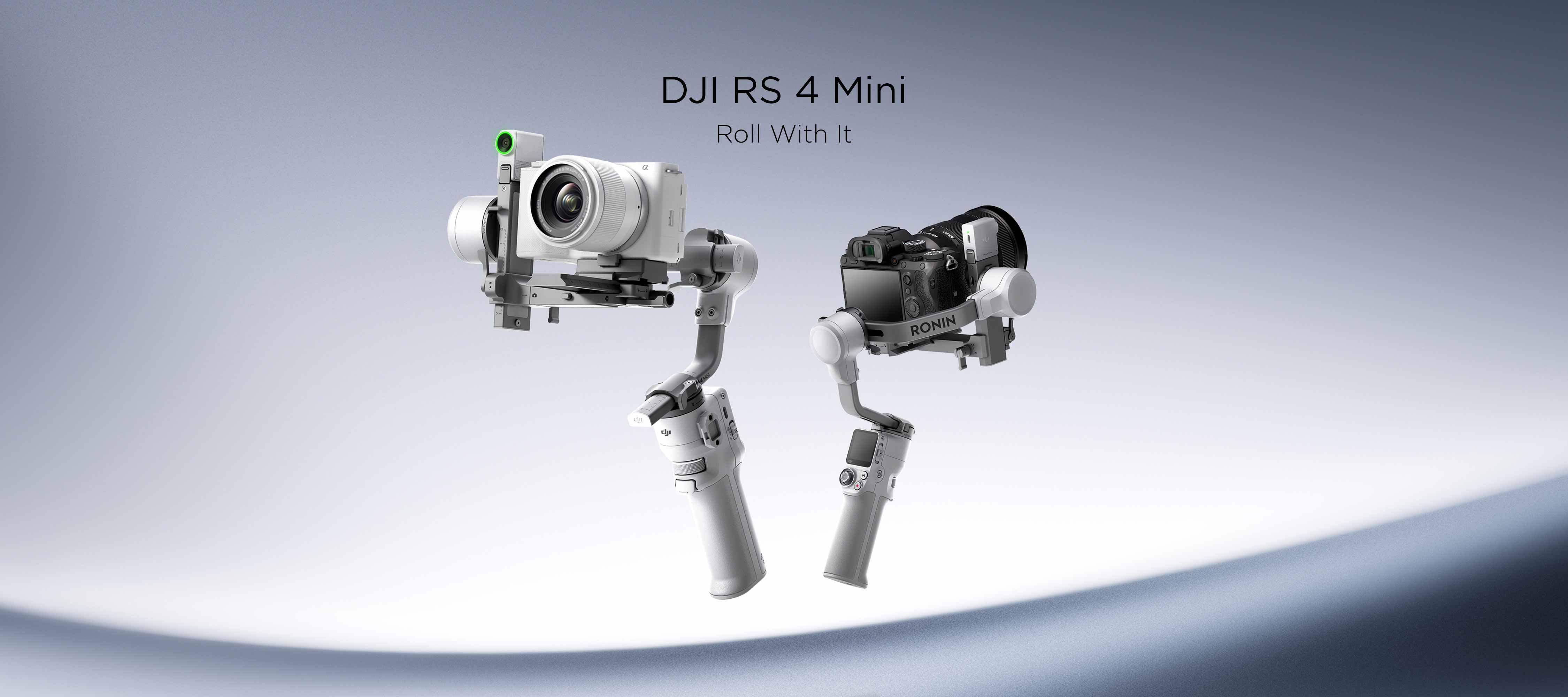 Two DJI RS 4 Minis with cameras attached against a grey background.