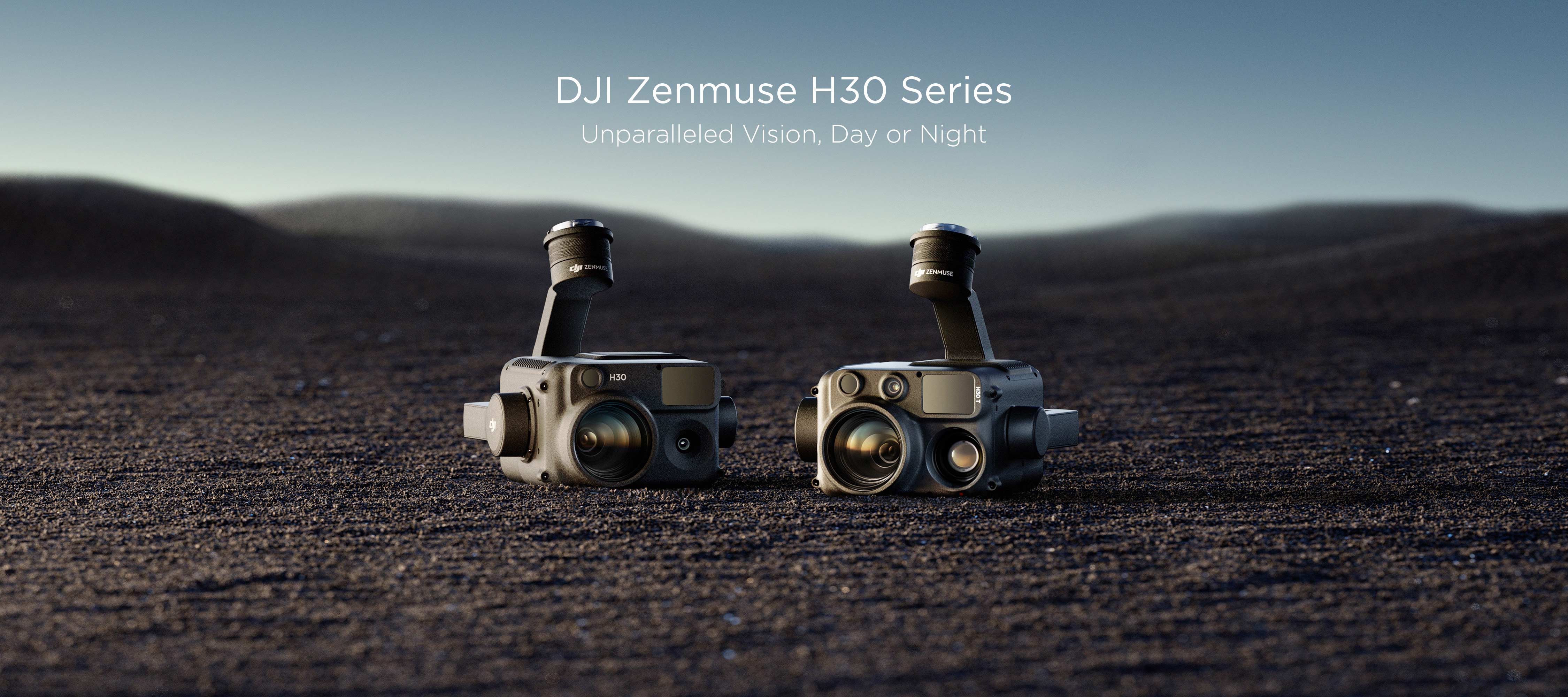 The DJI Zenmuse H30 and H30T displayed on sandy terrain with a blue sky in the background.