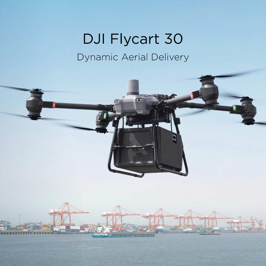 A DJI Flycart 30 transports a large container while cargo ships sail in the background.