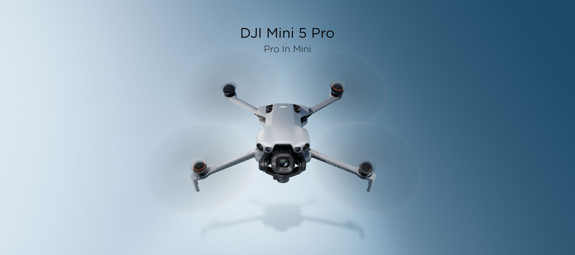 DJI Mini 5 Pro flying against a blue background.