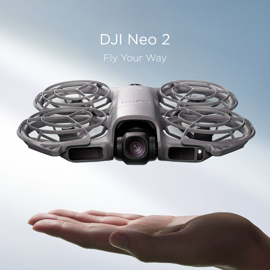 A hand hovers under a DJI Neo 2 drone