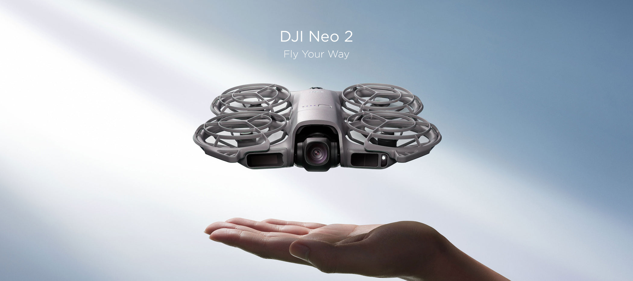 A hand hovers under at DJI Neo 2 drone